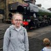 Image of Sophie Coates next to a train.