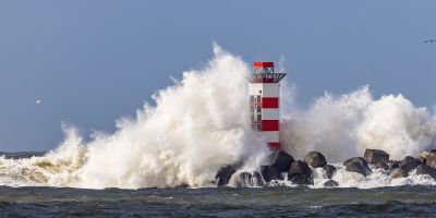 A lighthouse on the south pier in IJmuiden, Netherlands, being struck by breaking waves as tall as it, caused by the storm Dudley in February 2022.