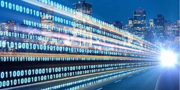 Data stream superimposed on city-scape and highway