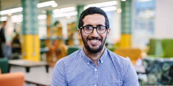 Masters student smiling at camera