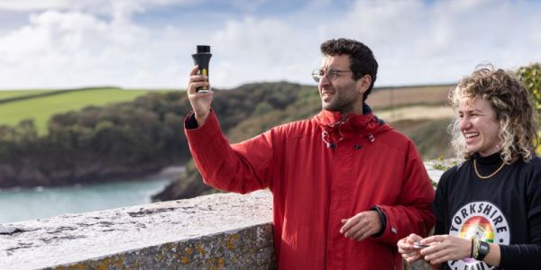 Two SEE students using equipment on Pembrokeshire field trip