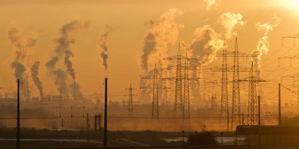 Image of air pollution being caused by industrial buildings